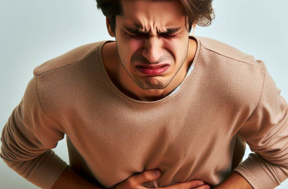 Person struggling with stomach pains